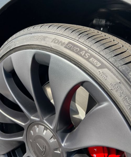 Repaired matte gray wheel rim with smooth restored edge