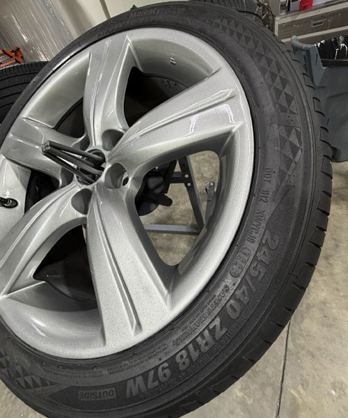 Repaired matte gray wheel rim with smooth restored edge